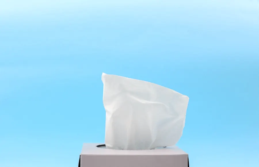 Soft white tissue rising from a tissue box